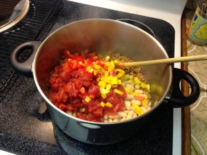 Add beans, lentils, tomatoes, red peppers, yellow peppers, thyme and pepper. Heat for a few minutes.