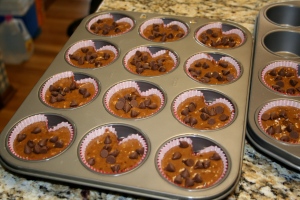 Place cupcake liners in muffin tins and fill each to about 3/4, or 2/3rds if you're going to make them heart-shaped. If making them heart-shaped--place a marble in each between the liner and the tin after adding the batter.